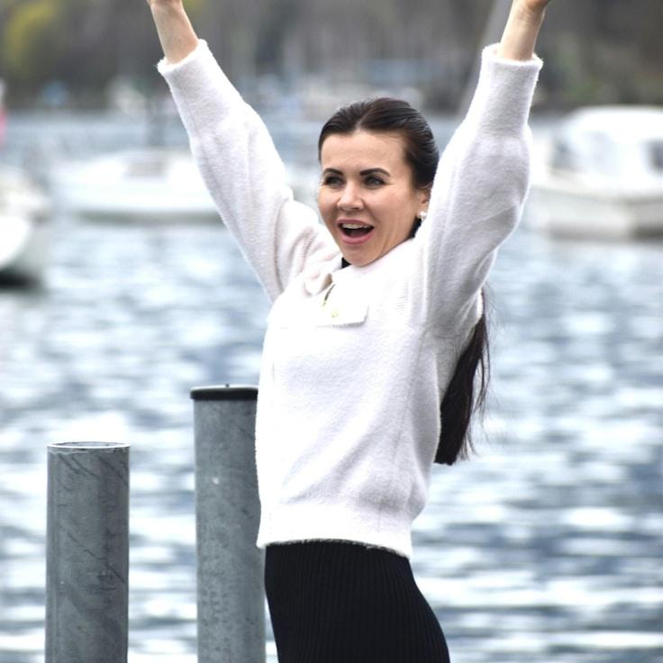 Aria Patel, Client Relations Director, discussing corporate gifting strategy with business clients